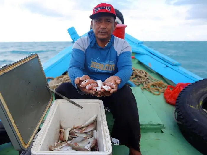 Figure 19: A fisher in Bangka is happy for the 80% increase of the catch due to PT Timah-supported fishing ground